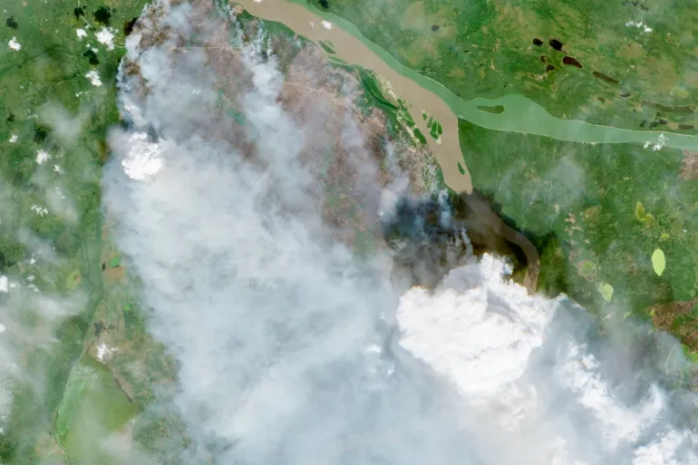 Fire FS016 and Fort Simpson are seen in a Sentinel-2 satellite image on July 4, 2026.