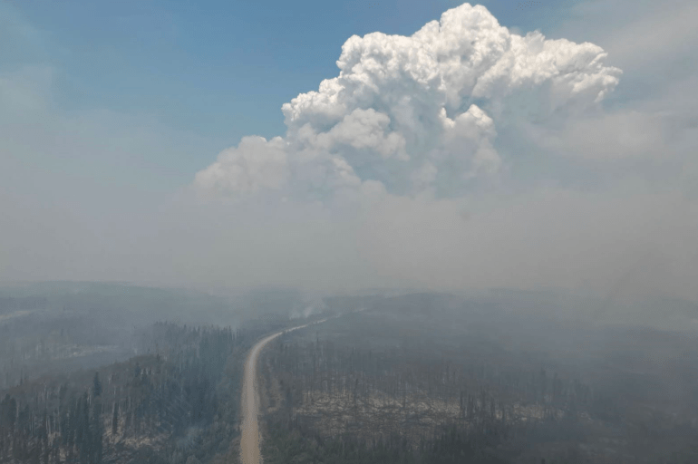 Wildfire FS016 on the highway looking north from Fort Simpson in the direction of Wrigley on July 7, 2026. Photo: NWT Fire