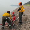 A crew outside Wrigley prepares pumps and hoses for a planned ignition. Photo: NWT Fire