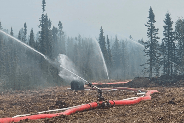 A high-volume suppression system installed near Wrigley, as depicted by NWT Fire in a series of images jointly credited to Connor Steed and Paul Klatt.