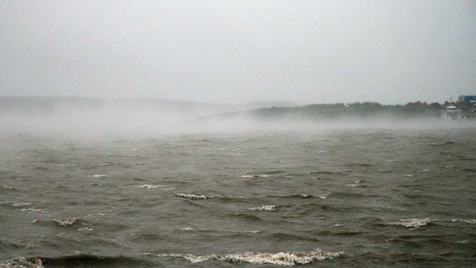 "Gale-force wind whips up mists on the Mackenzie River whilst stranded road traffic and the MV Louis Cardinal hunker down," Lawrence Norbert said of this photo taken on Friday, July 24.