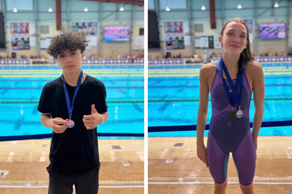 Spencer Nelson (left) and Louisa Henry following podium finishes at the ManSask swim meet. Photo: Submitted