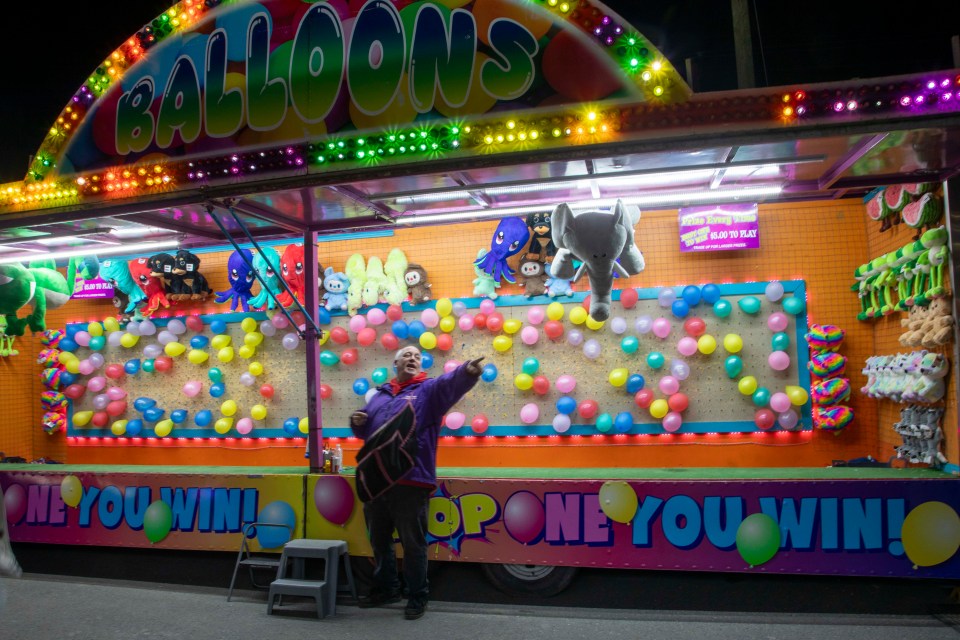 Pop a balloon to win at this stall. Photo: Bill Braden