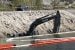 GNWT, contractor working to remove excavator from Pontoon Lake