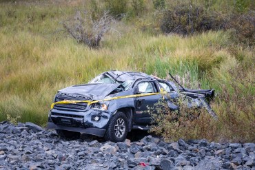 A truck is pictured in scrubland off the side of the Ingraham Trail just outside Yellowknife on August 24, 2026. Ollie Williams/Cabin Radio