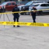 The scene of a shooting in Fort Smith is demarcated by caution tape on August 22, 2026. Ollie Williams/Cabin Radio