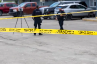 The scene of a shooting in Fort Smith is demarcated by caution tape on August 22, 2026. Ollie Williams/Cabin Radio