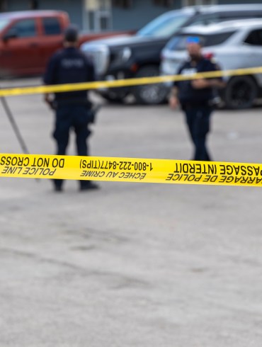 The scene of a shooting in Fort Smith is demarcated by caution tape on August 22, 2026. Ollie Williams/Cabin Radio