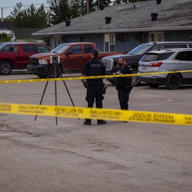 Police officers at the scene of Saturday's shooting outside the Dirty O'Fergie's bar. Ollie Williams/Cabin Radio