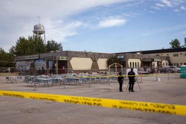 The scene of a shooting in Fort Smith is demarcated by caution tape on August 22, 2026. Ollie Williams/Cabin Radio