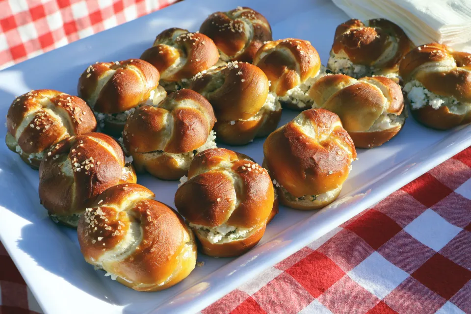 Small sandwiches on pretzel bread